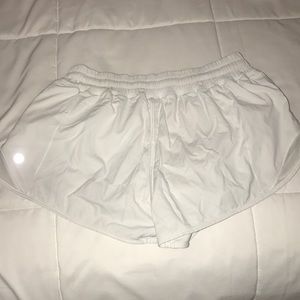 Size 4 white lululemon hotty hot shorts.